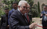 Lebanese Prime Minister Nawaf Salam, right, welcomes Palestinian Authority President Mahmoud Abbas before their meeting at the Government Palace in Beirut, Lebanon, Thursday, May 22, 2025. (AP Photo/Hassan Ammar)