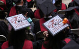 Graduates listen to speakers while displaying 'Free Palestine' signs on their mortarboards during commencement ceremonies at Harvard University, on May 29, 2025, in Cambridge, Massachusetts. (AP Photo/Charles Krupa)