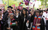 Graduates wave Palestinian flags during commencement ceremonies at Harvard University, in Cambridge, Massachusetts, on May 29, 2025. (AP Photo/Charles Krupa)