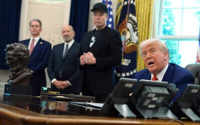 US President Donald Trump, from right, speaks during a news conference with Elon Musk as Commerce Secretary Howard Lutnick and Treasury Secretary Scott Bessent listen in the Oval Office of the White House, Friday, May 30, 2025, in Washington. (AP Photo/Evan Vucci)