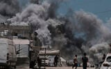 Smoke rises to the sky following an Israeli strike in Gaza City, June 1, 2025. (AP Photo/Jehad Alshrafi)