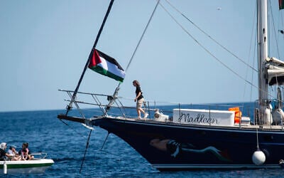 Climate activist Greta Thunberg boards the Madleen boat before setting sail for Gaza along with activists of the Freedom Flotilla Coalition, departing from the Sicilian port of Catania, Italy, June 1, 2025. (AP/Salvatore Cavalli)