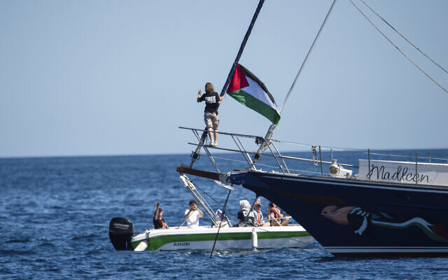 Activist Greta Thunberg stands near a Palestinian flag after boarding the Madleen boat and before setting sail for Gaza along with activists of the Freedom Flotilla Coalition, departing from the Sicilian port of Catania, Italy on June 1, 2025. (AP Photo/Salvatore Cavalli) Activist Greta Thunberg stands near a Palestinian flag after boarding the Madleen boat and before setting sail for Gaza along with activists of the Freedom Flotilla Coalition, departing from the Sicilian port of Catania, Italy on June 1, 2025. (AP Photo/Salvatore Cavalli)