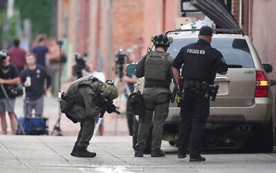 US law enforcement officials investigate after an attack on the Pearl Street Mall, June 1, 2025, in Boulder, Colorado. (AP Photo/David Zalubowski)