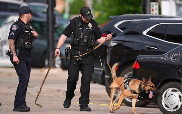 Law enforcement officials investigate after an attack on the Pearl Street Mall Sunday, June 1, 2025, in Boulder, Colo. (AP/David Zalubowski)