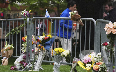Bouquets of flowers stand along a makeshift tribute for victims of an attack outside of the Boulder County, Colorado, courthouse in Boulder, Colorado, June 3, 2025. (David Zalubowski/ AP)