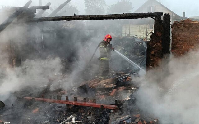 In this photo provided by the Ukrainian Emergency Service, firefighters put out the fire following Russia's drone attack in Pryluky, Ukraine, Thursday, June 5, 2025. (Ukrainian Emergency Service via AP)