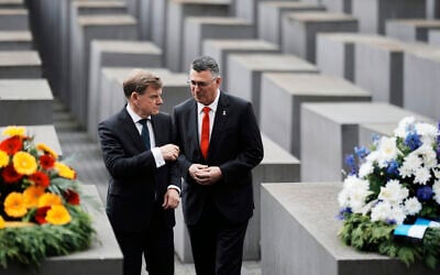 German Foreign Minister Johann Wadephul, left, and Israel's Foreign Minister Gideon Sa'ar attend a wreath laying ceremony at the Holocaust Memorial in Berlin, Germany, Thursday, June 5, 2025. (AP Photo/Markus Schreiber)