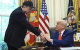 US President Donald Trump (right) shakes Elon Musk's hand in the Oval Office, Washington DC, May 30, 2025. (AP Photo/Evan Vucci)