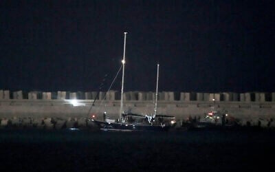 The boat Madleen, on which pro-Palestinian, anti-Israel activists attempted to break Israel's naval blockade of Gaza, seen under escort of Israeli naval forces as it enter Ashdod Port in southern Israel after being intercepted by Israeli forces, June 9, 2025. (AP/Leo Correa)