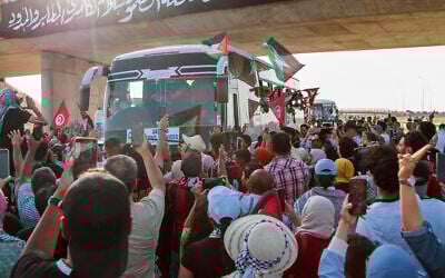 People cheer as a convoy of buses from North Africa depart from Tunisia to Gaza to break Israel's blockade on the Hamas-ruled territory, in Gabes, Tunisia, June 9, 2025. (AP)