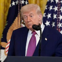 US President Donald Trump listens during an event to sign a bill blocking California's rule banning the sale of new gas-powered cars by 2035, in the East Room of the White House, June 12, 2025. (AP/Alex Brandon)