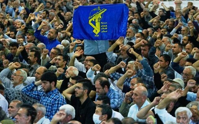An Iranian worshipper holds up a banner containing the Revolutionary Guard emblem as the others chant slogans during Friday prayers ceremony at Tehran University campus in Tehran, Iran, June 13, 2025. (AP/Vahid Salemi) An Iranian worshipper holds up a banner containing the Revolutionary Guard emblem as the others chant slogans during Friday prayers ceremony at Tehran University campus in Tehran, Iran, June 13, 2025. (AP/Vahid Salemi)