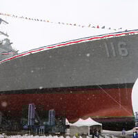 The future USS Thomas Hudner, a US Navy destroyer named after Korean War veteran Thomas Hudner, during christening ceremony at Bath Iron Works in Bath, Maine,  April 1, 2017. (AP Photo/Mary Schwalm, File)