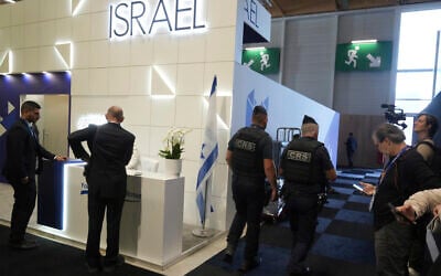 Riot police officers patrol by the Israeli pavilions at the Paris Air Show, June 16, 2025 in Le Bourget, north of Paris. (AP Photo/Michel Euler)