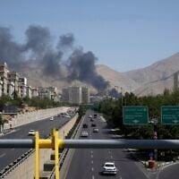 Smoke rises from an oil storage facility after it appeared to have been struck by an Israeli strike in Tehran, Iran, on  Monday, June 16, 2025. (AP Photo/Vahid Salemi)
