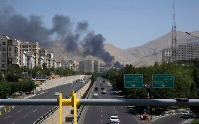 Smoke rises from an oil storage facility after it appeared to have been struck by an Israeli strike in Tehran, Iran, on  Monday, June 16, 2025. (AP Photo/Vahid Salemi)