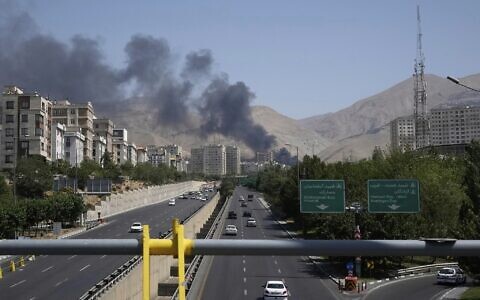 Smoke rises from an oil storage facility after it appeared to have been struck by an Israeli strike, in Tehran, Iran, Monday, June 16, 2025. (AP/Vahid Salemi)