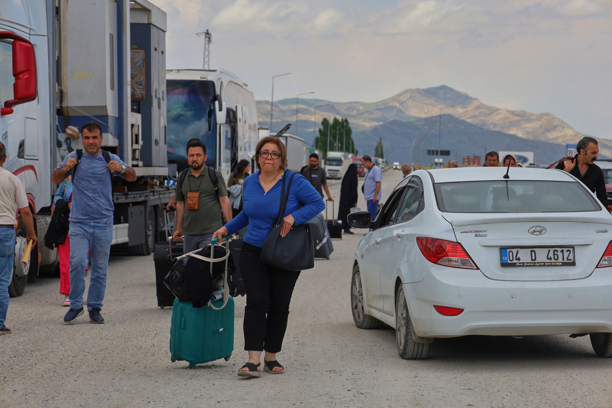 NextImg:Bumper-to-bumper traffic on roads out of Tehran as residents flee Israeli strikes