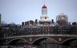 Rowers paddle down the Charles River near the campus of Harvard University in Cambridge, Massachusetts, March 7, 2017. (AP Photo/Charles Krupa, File)