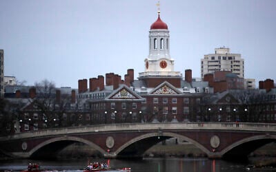 FILE - Rowers paddle down the Charles River near the campus of Harvard University in Cambridge, Massachusetts, March 7, 2017. (AP Photo/Charles Krupa, File)