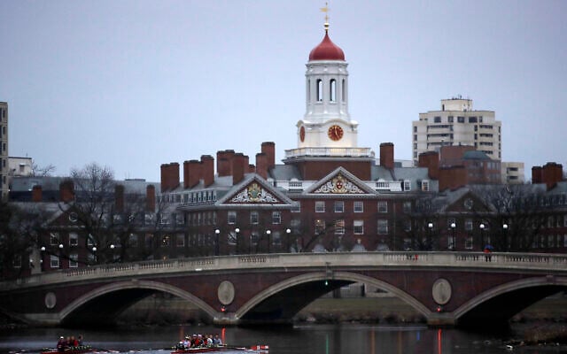 FILE - Rowers paddle down the Charles River near the campus of Harvard University in Cambridge, Massachusetts, March 7, 2017. (AP Photo/Charles Krupa, File)