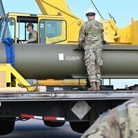 In this photo released by the US Air Force on May 2, 2023, airmen look at a GBU-57, or the Massive Ordnance Penetrator bomb, at Whiteman Air Base in Missouri. (US Air Force via AP, File)