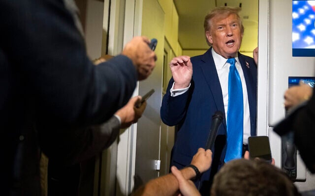 US President Donald Trump speaks with reporters while flying aboard Air Force One en route from Calgary, Canada to Joint Base Andrews, Md., late Monday, June 16, 2025. (AP/Mark Schiefelbein)