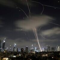 Israeli air defense systems fire to intercept missiles during an Iranian attack over Tel Aviv, Israel, June 18, 2025. (AP/Leo Correa)
