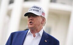 US President Donald Trump speaks as a flag pole is installed on the South Lawn of the White House, in Washington, June 18, 2025. (Evan Vucci/AP)