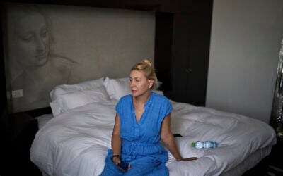 Ukrainian makeup artist Tetiana Kurakova, 40, sits in a hotel in Tel Aviv on June 17, 2025, that was turned into a shelter for evacuees from Bat Yam, which was hit by an Iranian strike. (AP/Leo Correa)