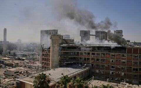 Smoke rises from a building of the Soroka hospital complex in Beersheba after it was hit by a missile fired from Iran, June 19, 2025. (AP Photo/Leo Correa)