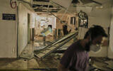 A medical staffer walks along a damaged area at the Soroka hospital complex after it was hit by a missile fired from Iran in Beersheba, June 19, 2025. (AP/Leo Correa)