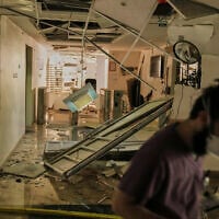 A medical staffer walks along a damaged area at the Soroka hospital complex after it was hit by a missile fired from Iran in Beersheba, Israel, Thursday, June 19, 2025. (AP Photo/Leo Correa)