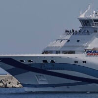 The cruise ship Crown Iris carrying thousands of stranded Israeli citizens back to Israel departs from Cyprus' main Limassol port on, June 19, 2025. (AP Photo/Petros Karadjias)