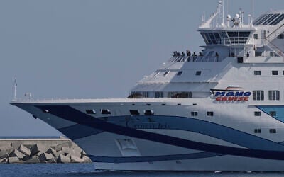 The cruise ship Crown Iris carrying thousands of stranded Israeli citizens back to Israel departs from Cyprus' main Limassol port on, June 19, 2025. (AP Photo/Petros Karadjias)