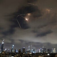 Israeli air defenses fire intercept missiles during an Iranian attack over Tel Aviv, early June 21, 2025. (AP Photo/Leo Correa)