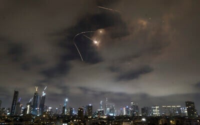 Israeli air defenses fire intercept missiles during an Iranian attack over Tel Aviv, early June 21, 2025. (AP Photo/Leo Correa)