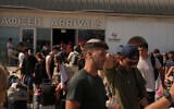 Travelers leaving Israel arrive at Cyprus' main port of Limassol aboard the cruise ship Crown Iris, June 21, 2025. (AP Photo/Petros Karadjias)