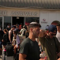 Travelers leaving Israel arrive at Cyprus' main port of Limassol aboard the cruise ship Crown Iris, June 21, 2025. (AP Photo/Petros Karadjias)
