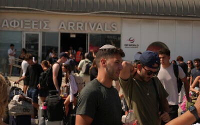 Travelers leaving Israel arrive at Cyprus' main port of Limassol aboard the cruise ship Crown Iris, June 21, 2025. (AP Photo/Petros Karadjias)