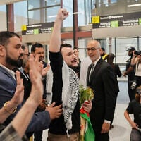 Mahmoud Khalil, center, reacts as he is greeted upon arriving at Newark International Airport, in Newark, New Jersey, June 21, 2025. (Seth Wenig/AP)