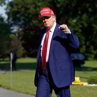 US President Donald Trump walks on the South Lawn upon arriving at the White House, Saturday, June 21, 2025, in Washington. (AP Photo/Jose Luis Magana)