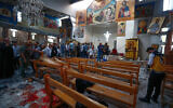Syrians gather inside Mar Elias church where a suicide bomber detonated himself in Dweila, on the outskirts of Damascus, Syria, on June 22, 2025. (AP Photo/ Omar Sanadiki)