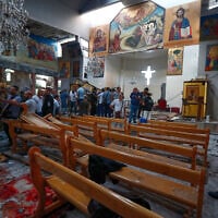 Syrians gather inside Mar Elias church where a suicide bomber detonated himself in Dweila, on the outskirts of Damascus, Syria, on June 22, 2025. (AP Photo/ Omar Sanadiki)