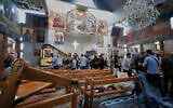 Syrian citizens and security forces inspect the damage inside the Mar Elias church where a suicide bomber detonated himself in Dweila, on the outskirts of Damascus, Syria, June 22, 2025. (AP Photo/ Omar Sanadiki)