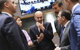 French Foreign Minister Jean-Noel Barrot, center, speaks with, from left, Malta's Foreign Minister Ian Borg, Slovenia's Foreign Minister Tanja Fajon, Slovakia's Foreign Minister Juraj Blanar and Spain's Foreign Minister Jose Manuel Albares Bueno during a meeting of EU foreign ministers at the European Council building in Brussels, Belgium, June 23, 2025. (AP Photo/Virginia Mayo)