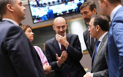 French Foreign Minister Jean-Noel Barrot, center, speaks with, from left, Malta's Foreign Minister Ian Borg, Slovenia's Foreign Minister Tanja Fajon, Slovakia's Foreign Minister Juraj Blanar and Spain's Foreign Minister Jose Manuel Albares Bueno during a meeting of EU foreign ministers at the European Council building in Brussels, Belgium, June 23, 2025. (AP Photo/Virginia Mayo)