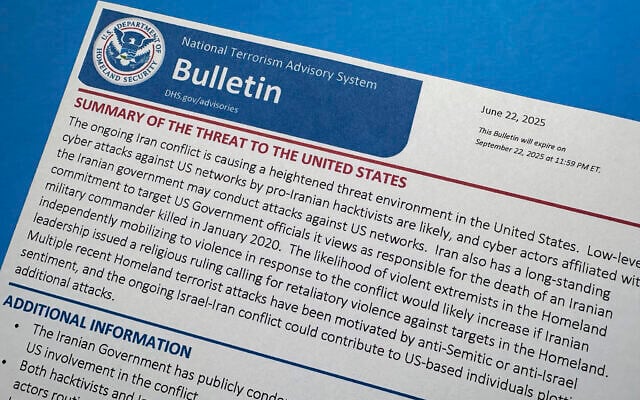 A National Terrorism Advisory System bulletin issued by the US Department of Homeland Security warning of a "heightened threat environment" following US strikes on Iranian nuclear sites, is photographed June 23, 2025. (AP Photo/Jon Elswick)