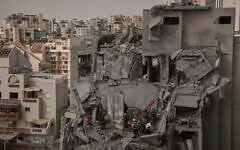 Israeli soldiers and rescue team work amid the rubble of residential buildings destroyed by an Iranian missile strike that killed several people, in Beersheba, Israel, June 24, 2025. (AP Photo/Leo Correa)